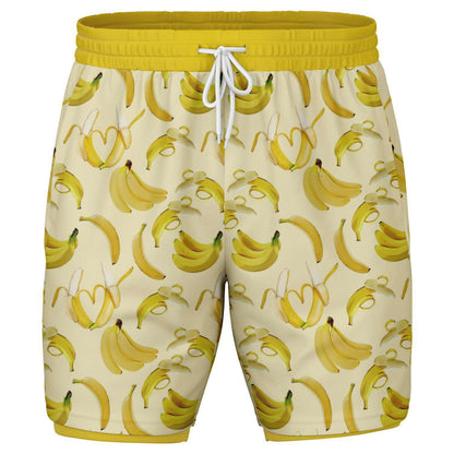 Men's 2-in-1 Shorts. These fun yellow workout shorts feature a banana design. Shorts have a drawstring, zip up side pockets, and hidden phone pocket.