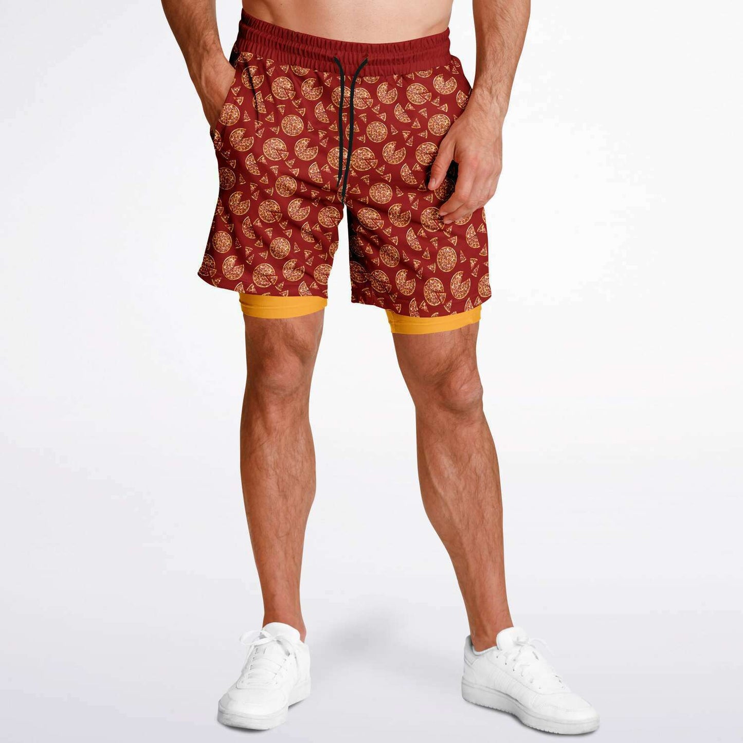 Men's shorts featuring a pizza design of pizza pies and pizza slices on a red background with an orange/yellow under short.