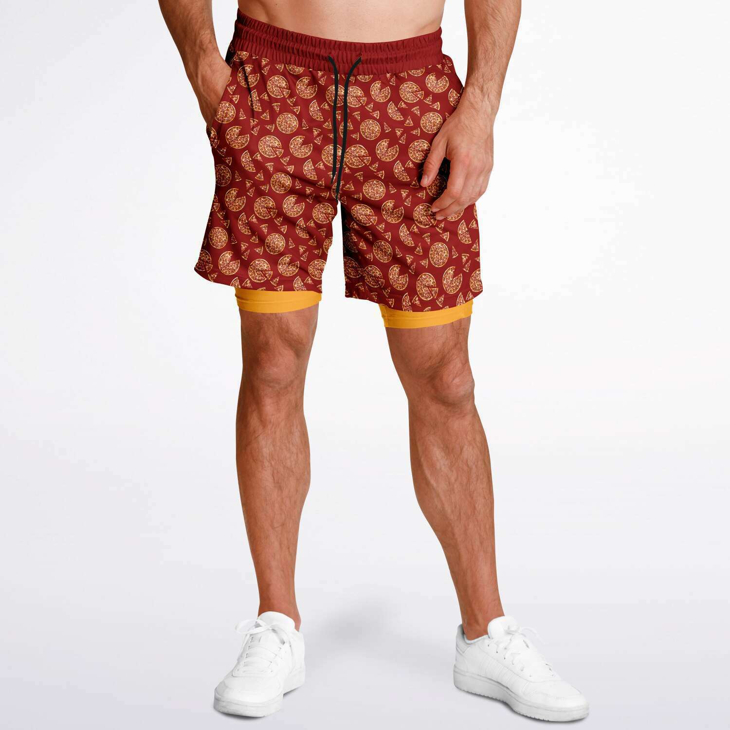 Men's shorts featuring a pizza design of pizza pies and pizza slices on a red background with an orange/yellow under short.