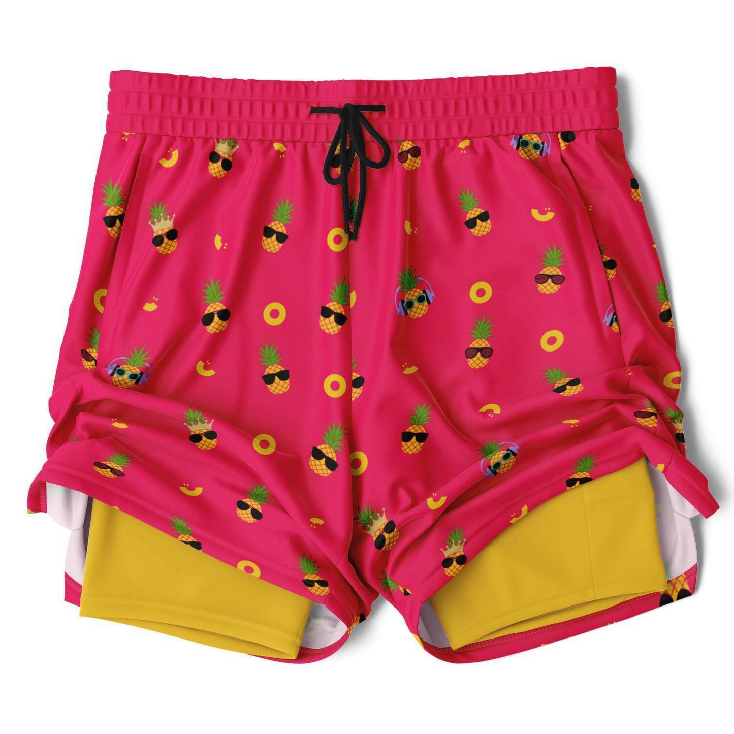 Men's 2-in-1 Shorts. These fun shorts feature a pink background with pineapples wearing a variety of sunglasses. Shorts have a black drawstring and zip up pockets.