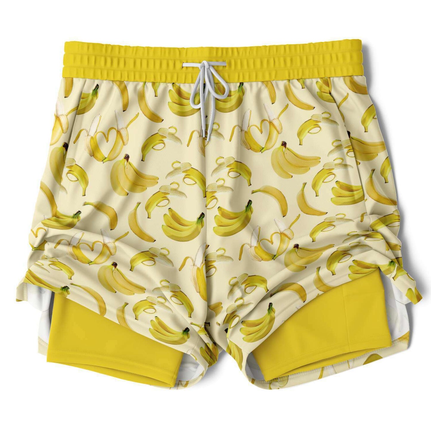 Men's 2-in-1 Shorts. These fun yellow workout shorts feature a banana design. Shorts have a drawstring, zip up side pockets, and hidden phone pocket.