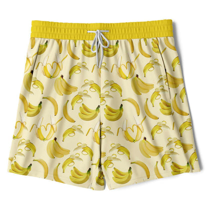 Men's 2-in-1 Shorts. These fun yellow workout shorts feature a banana design. Shorts have a drawstring, zip up side pockets, and hidden phone pocket.