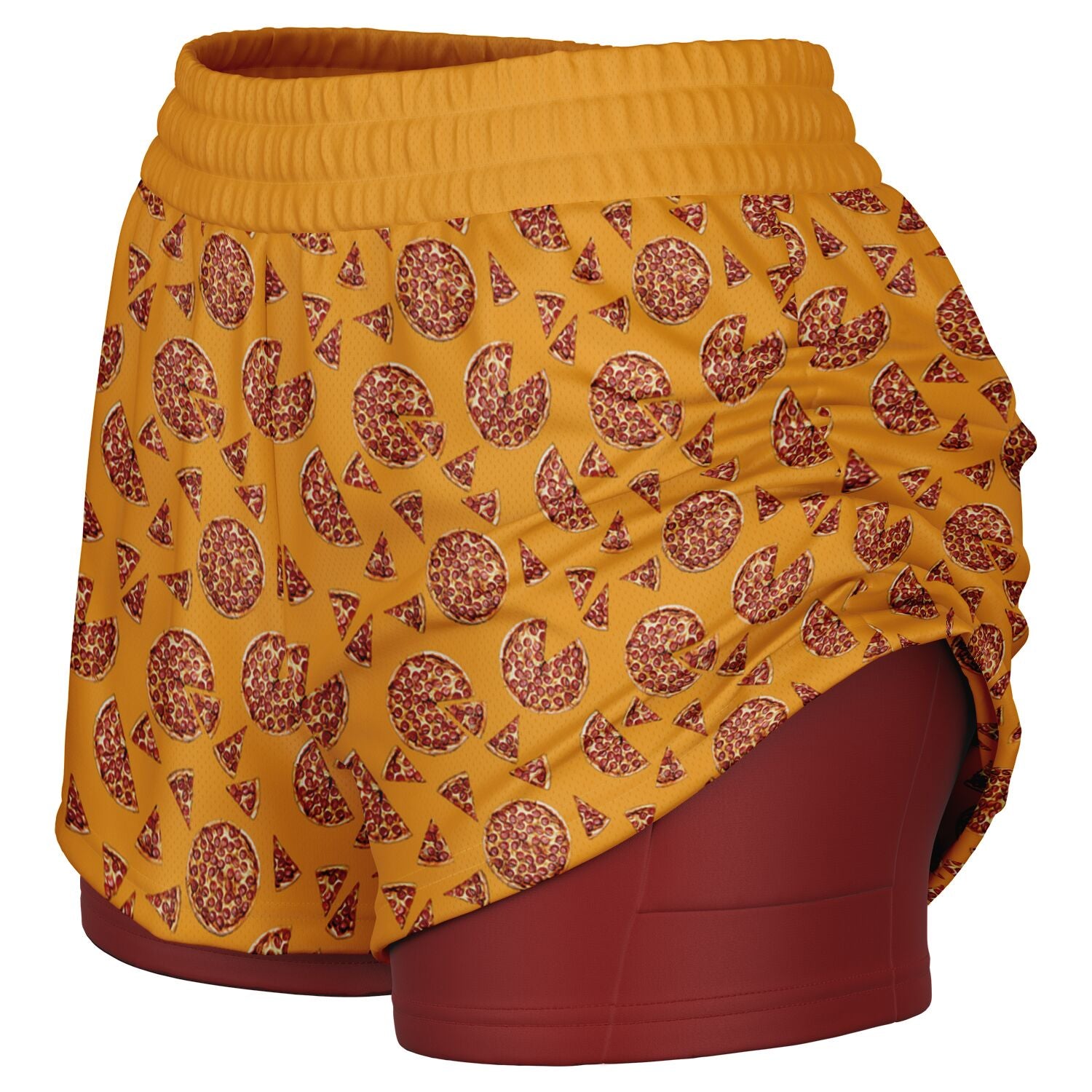 Women's shorts featuring a pizza design of pizza pies and pizza slices on a yellow background with a red undershort that features a phone pocket.