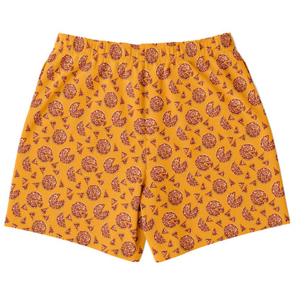 Men’s shorts featuring a pizza design of pizza pies and pizza slices on a yellow/orange background with two side pockets.