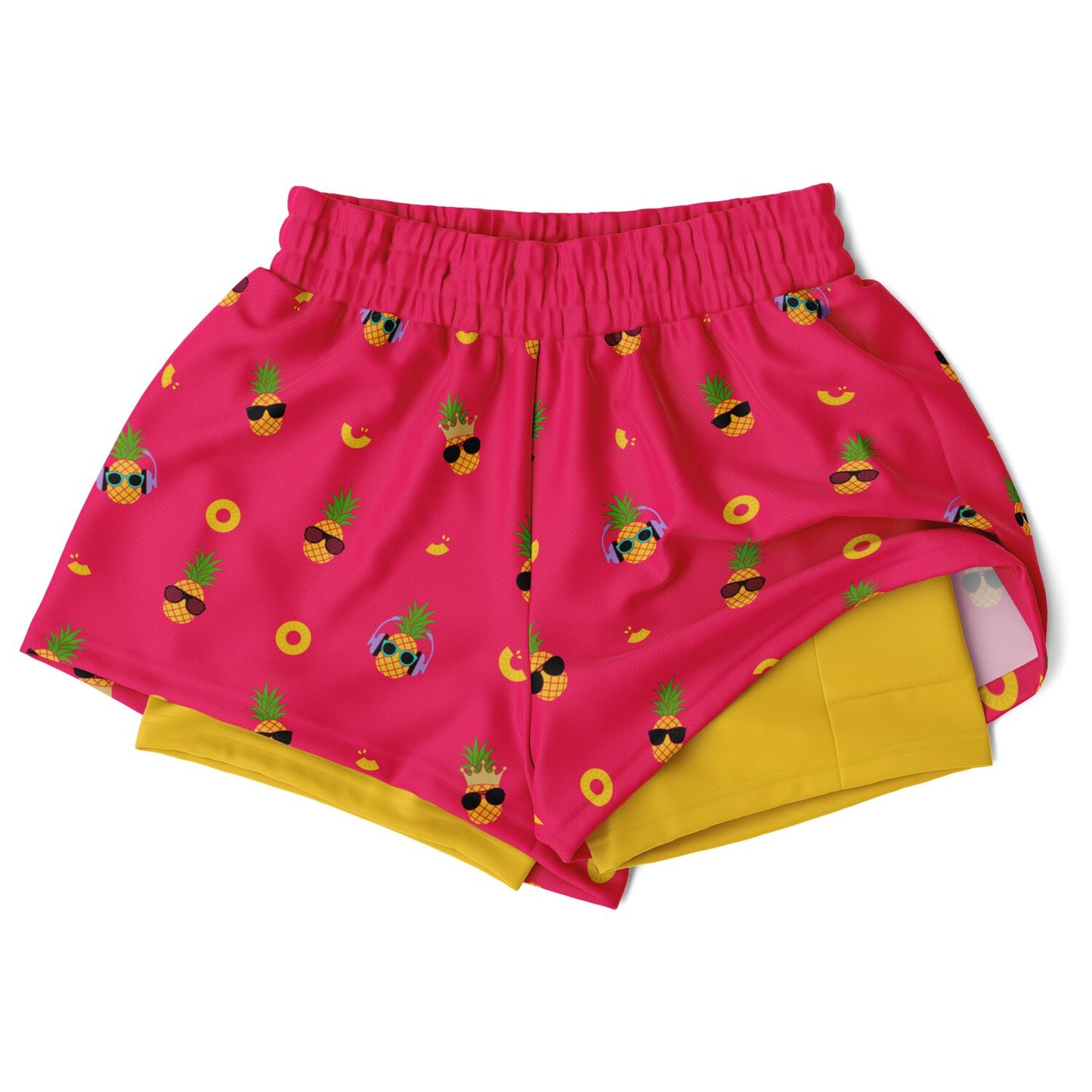 Women's 2-in-1 Shorts. These fun shorts feature a pink background with pineapples wearing a variety of sunglasses, and a yellow under-short with a hidden phone pocket.